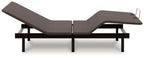 Adjustable base bed frame with dark gray raised head section and foot platform