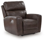 Dark smoke-brown power recliner with padded headrest, wide arms, and side control panel