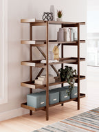 Brown wooden bookcase with multiple open shelves and X-style supports