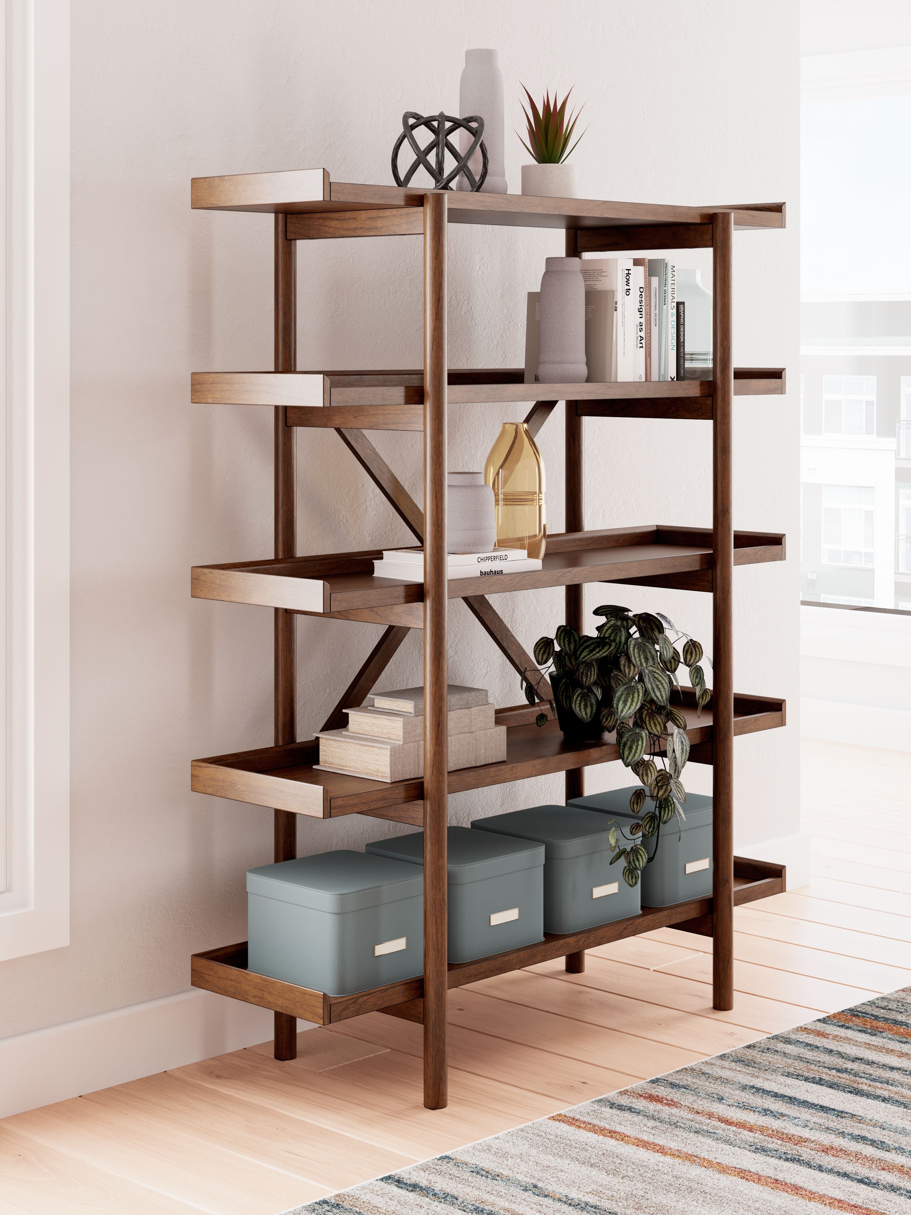 Brown wooden bookcase with multiple open shelves and X-style supports