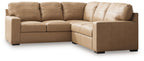 Light brown fabric sectional sofa with chaise and padded armrests