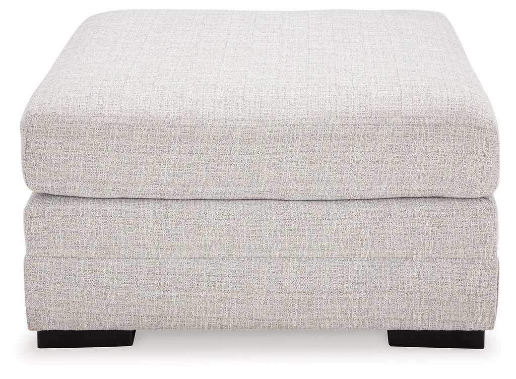 Stone oversized ottoman with rounded square cushions and dark block feet