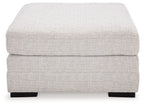 Stone oversized ottoman with rounded square cushions and dark block feet