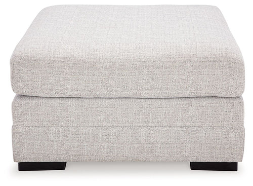 Stone oversized ottoman with rounded square cushions and dark block feet
