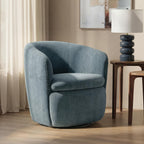 Swivel accent chair in blue-gray velvet with rounded arms and cushioned seat.