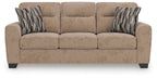 Light brown sofa with three seat cushions and two striped throw pillows