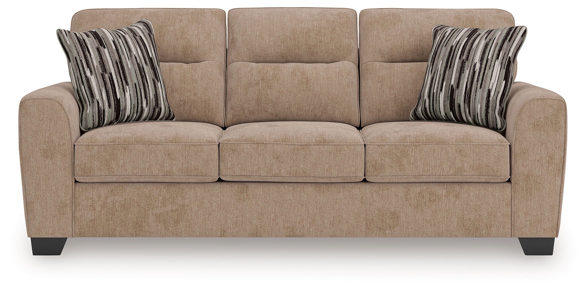 Light brown sofa with three seat cushions and two striped throw pillows