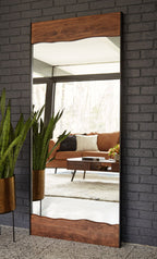 Full-length floor mirror with brown wood frame and reflective glass panel