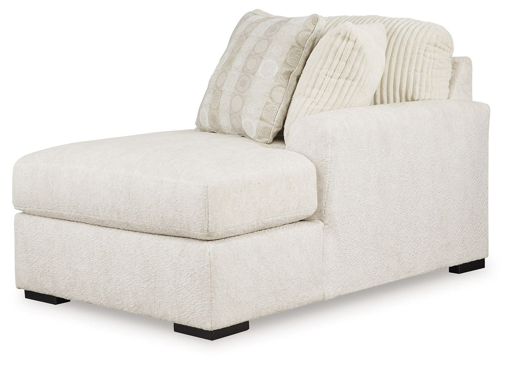 Ivory corner chaise sectional with fitted cushions and ribbed textured pillows