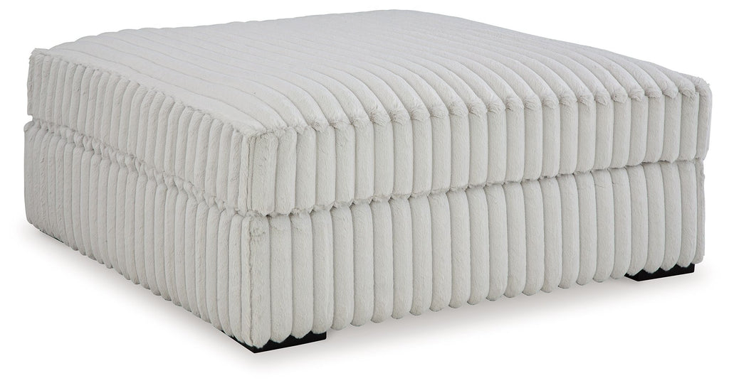 Oversized accent ottoman, light gray ribbed upholstery and padded top