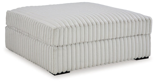 Oversized accent ottoman, light gray ribbed upholstery and padded top