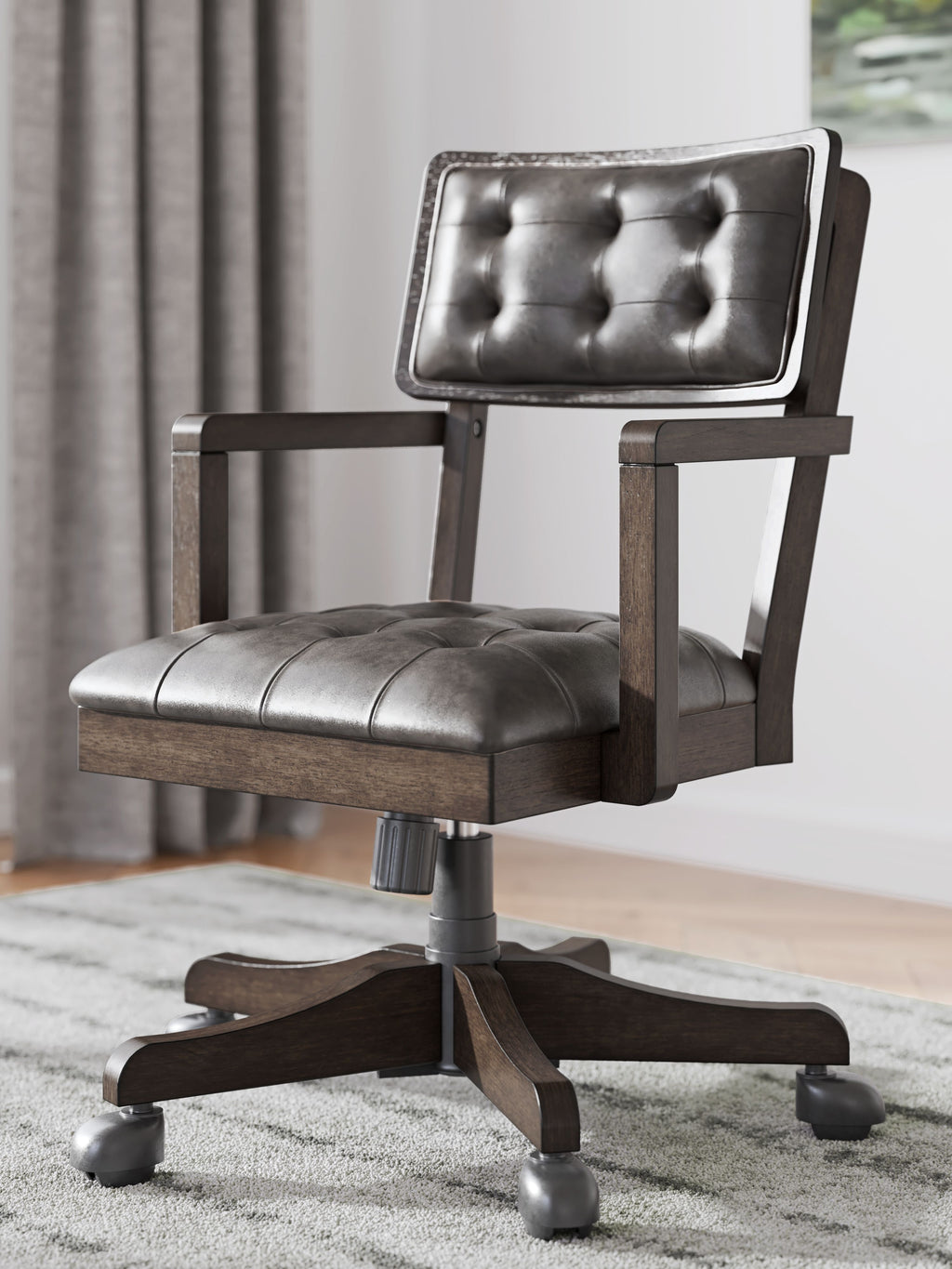 Dark brown tufted office chair with padded seat and swivel base
