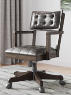 Dark brown tufted office chair with padded seat and swivel base