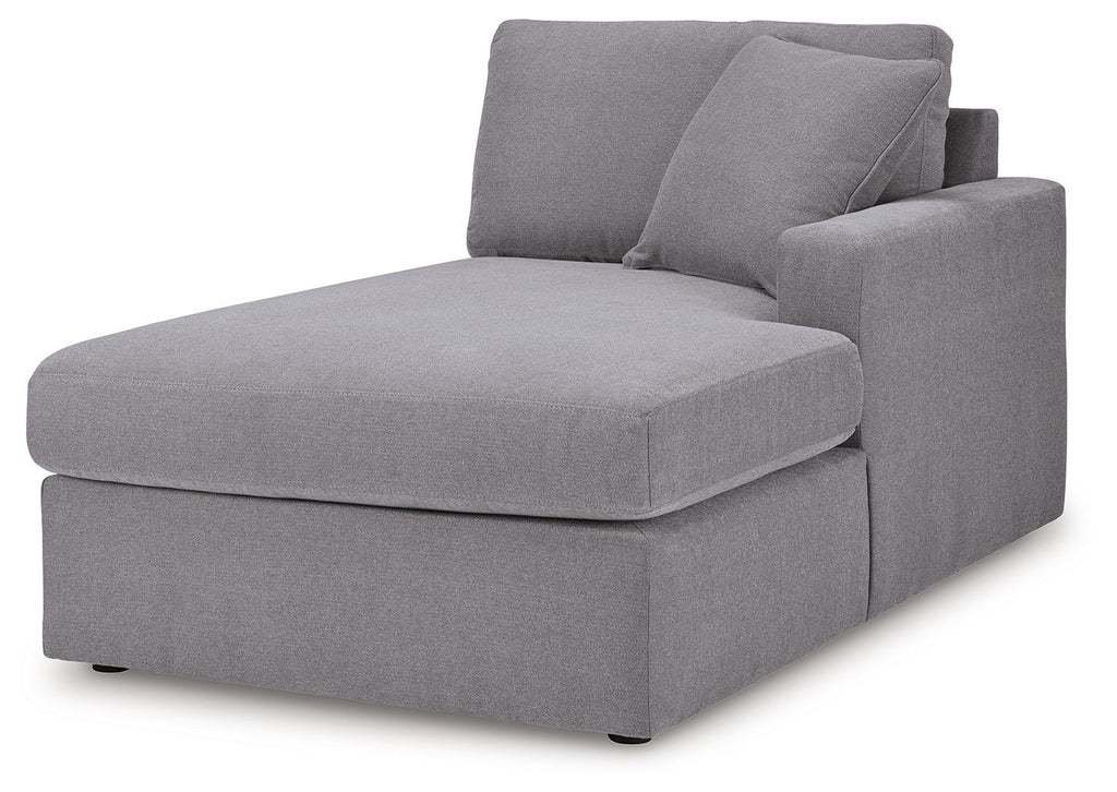 Gray fabric chaise corner with back cushions and ottoman-style seat