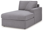 Gray fabric chaise corner with back cushions and ottoman-style seat