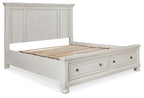 White panel storage bed with two drawers; platform raised to reveal storage