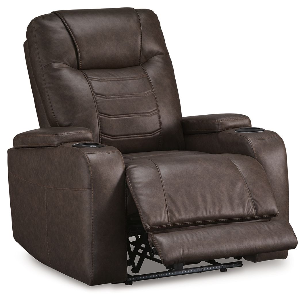 Dark brown power recliner with adjustable headrest, padded armrests, and recline footrest