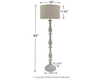 Whitewash poly floor lamp with beige drum shade and turned pedestal stem