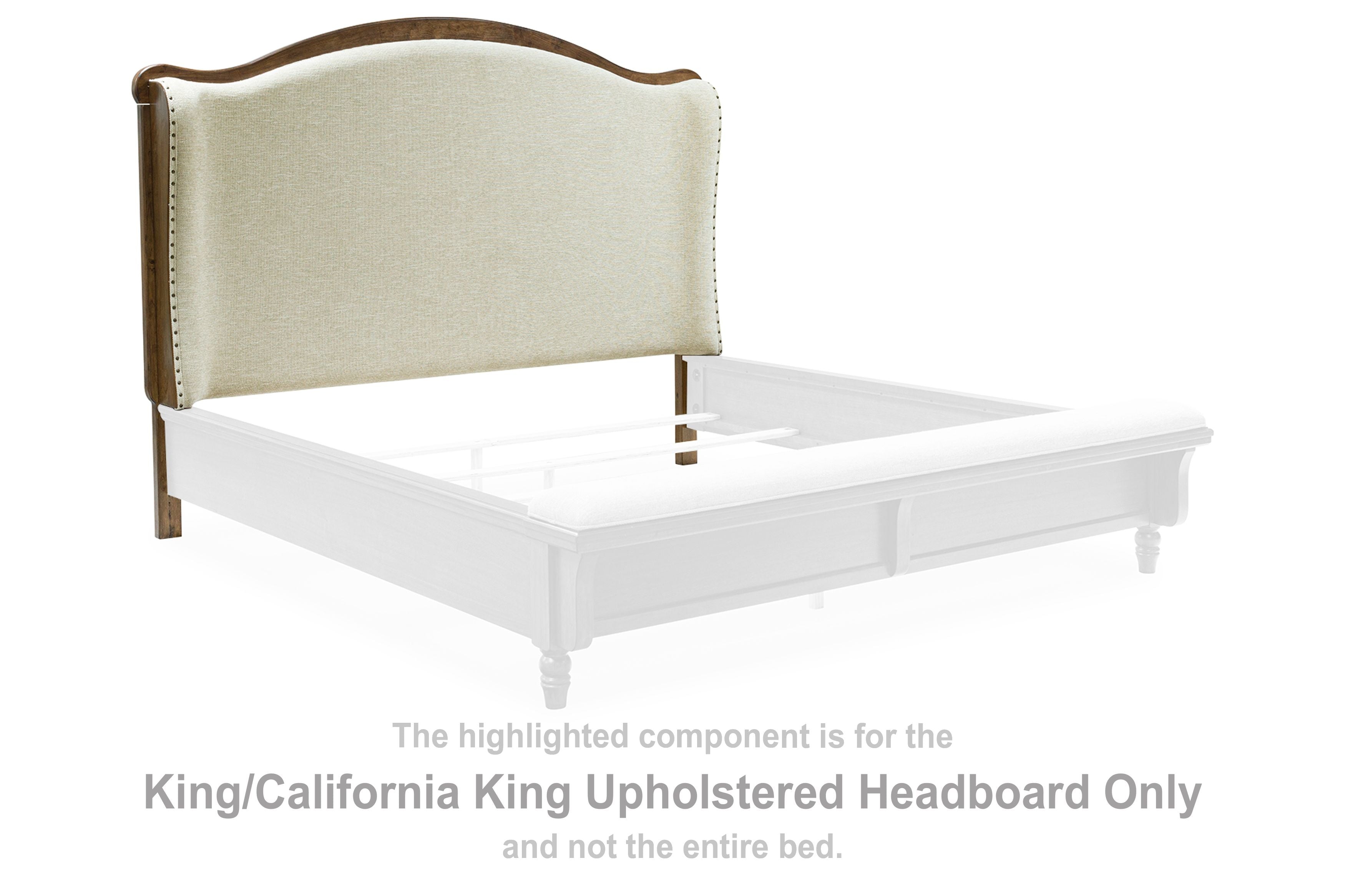 Upholstered headboard with beige fabric and brown wood posts