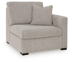 Flint gray fabric corner chair with right arm, tufted seat back and black legs