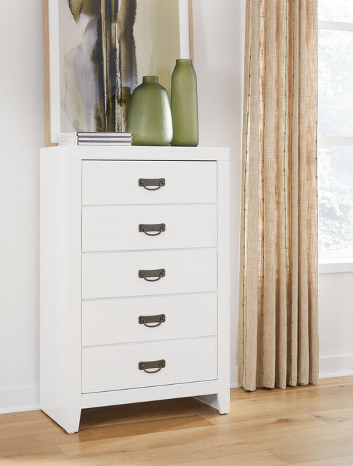 White five-drawer chest with five drawers and dark metal handles