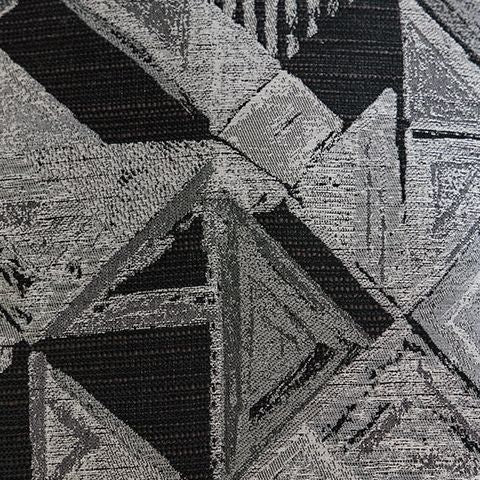 Black corduroy upholstery with vertical channel stitching and textured cushion surface