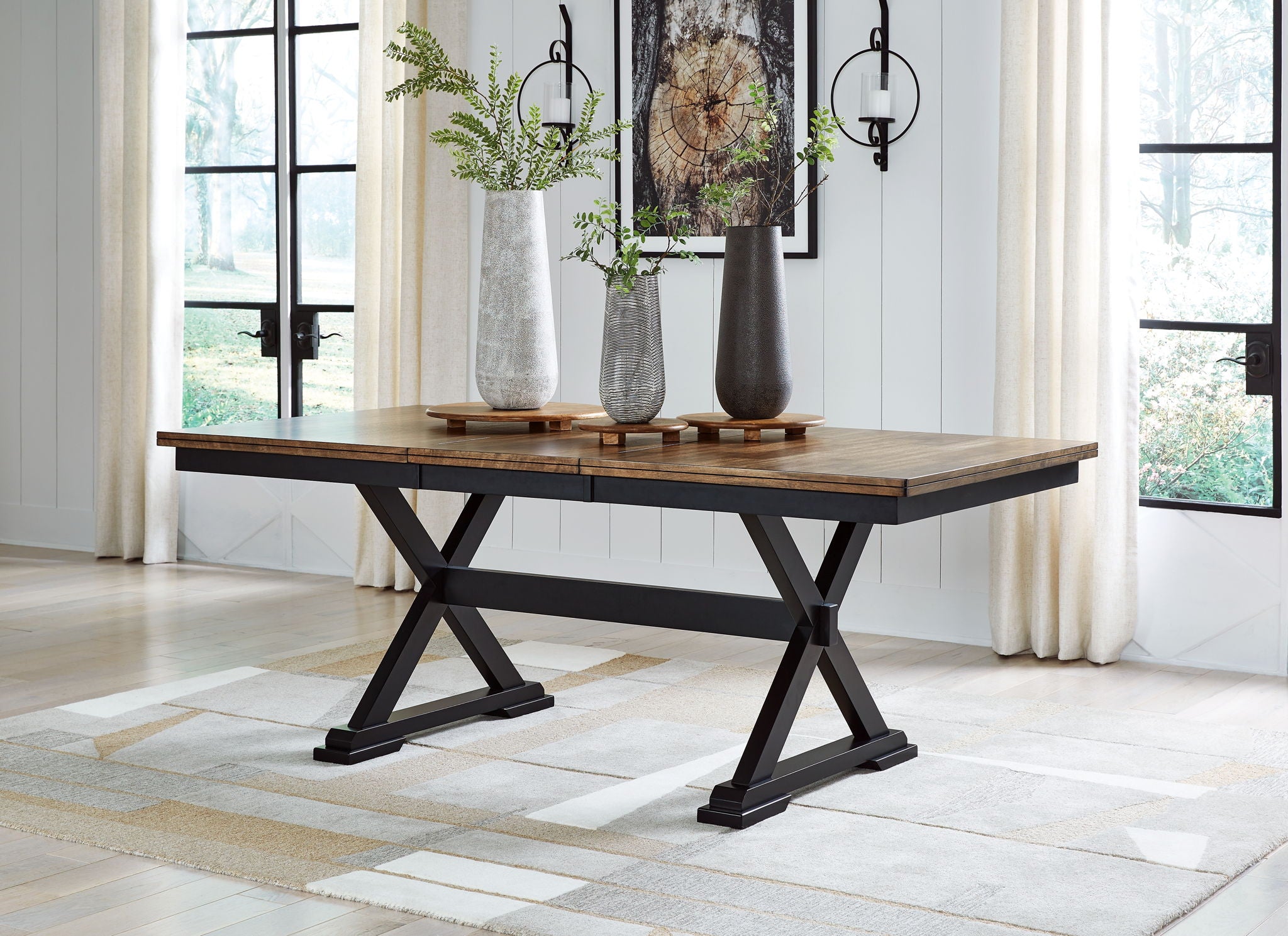 Dark brown dining table with black X-base and square tabletop
