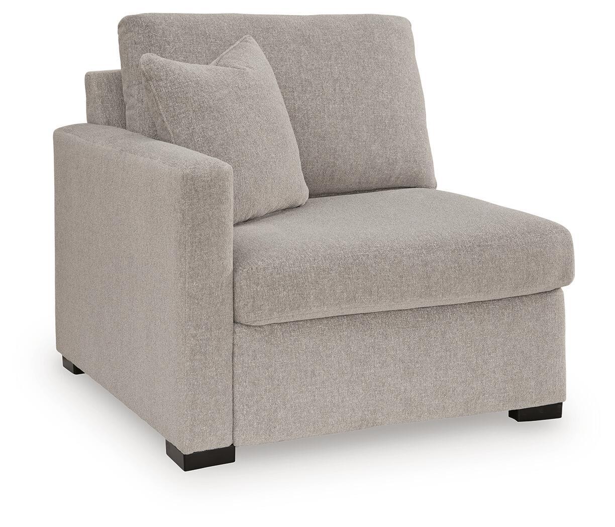 Grey corner chair with left-facing arm, upholstered fabric, square base feet