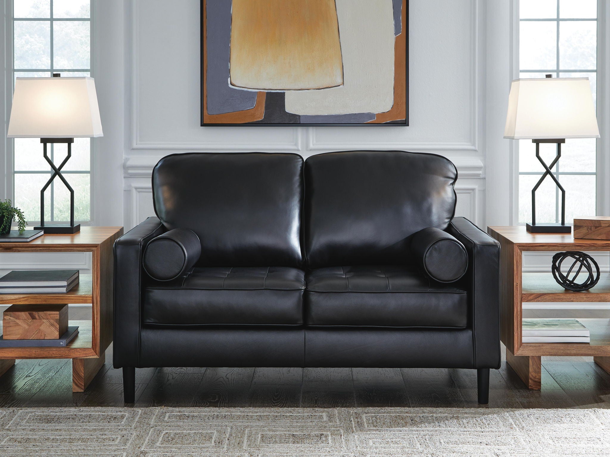 Loveseat with onyx dark upholstery, deep seats, and rounded armrests