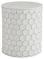 White upholstered stool with geometric trellis pattern and round top