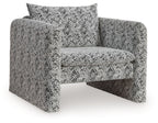 Accent chair with black-and-white patterned fabric, square seat and padded backrest