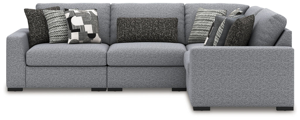 Gray sectional sofa with corner chaise and patterned throw pillows