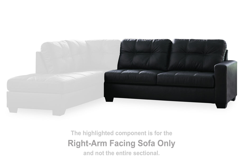 Dark sofa section beside white chaise, tufted back and padded armrests