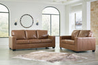 Brown leather sofa and matching armchair with padded seats and square arms