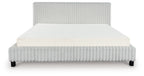 Upholstered bed with light ribbed headboard and sides, white mattress