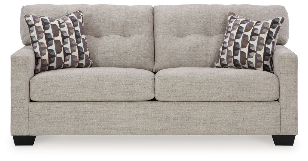 Pebble sofa sleeper with two patterned throw pillows and clean, cushioned seat