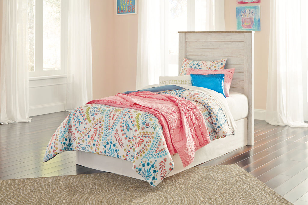 Beige upholstered headboard with horizontal paneling on a bed frame