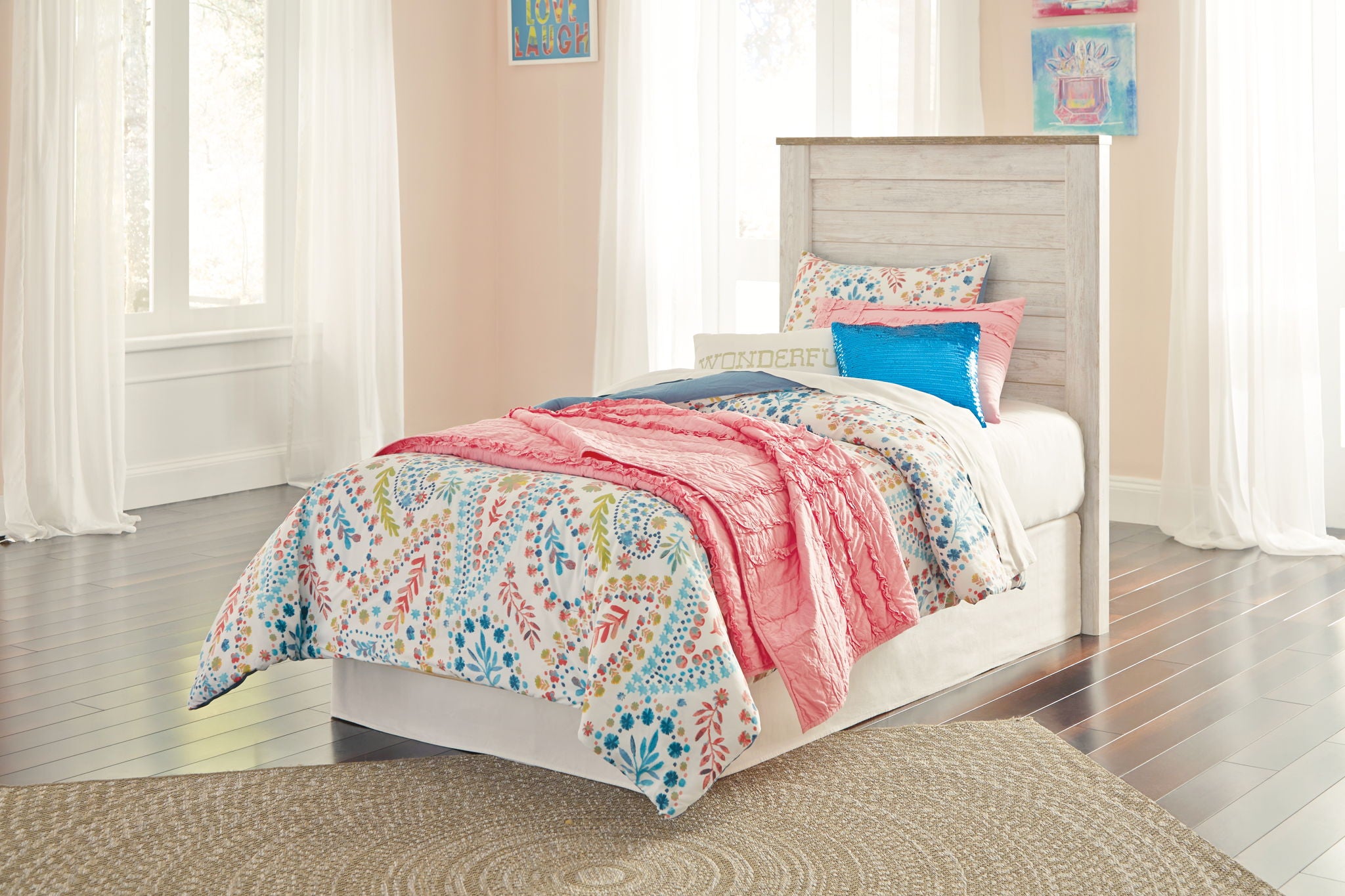 Beige upholstered headboard with horizontal paneling on a bed frame