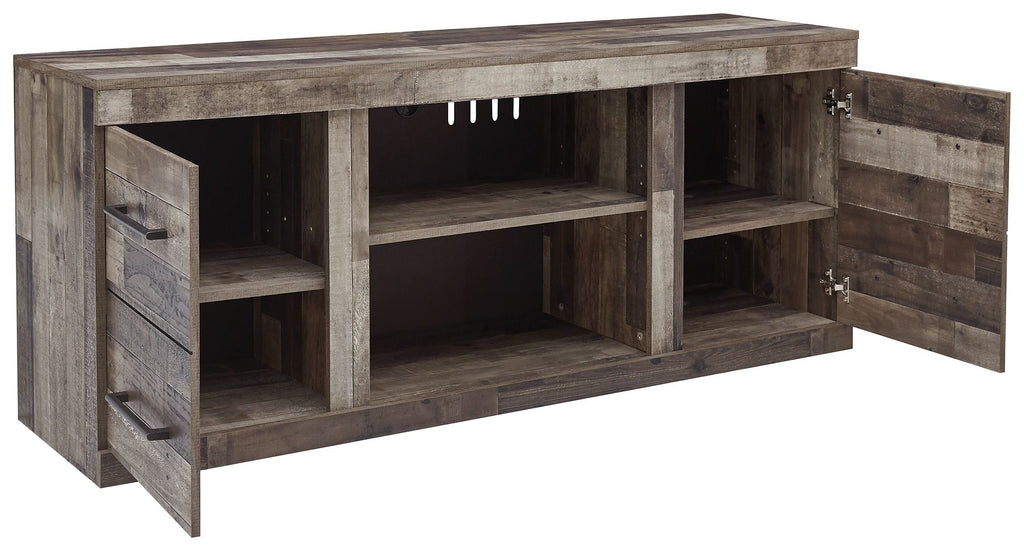 Gray TV console with open shelves and angled side cabinets with doors