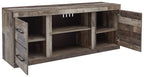 Gray TV console with open shelves and angled side cabinets with doors