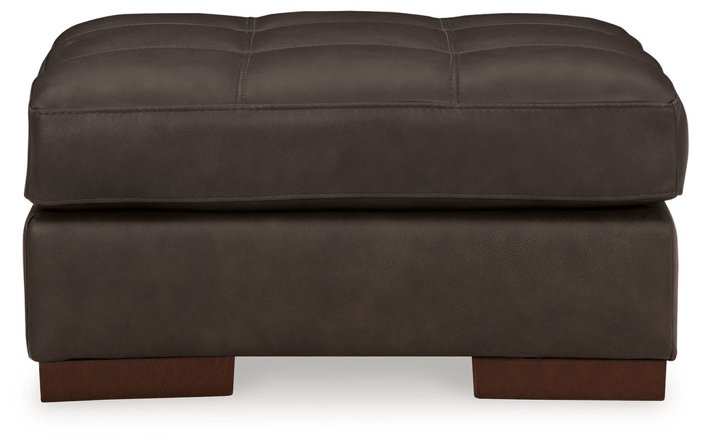 Dark brown upholstered ottoman with tufted top, thick base, exposed wooden feet