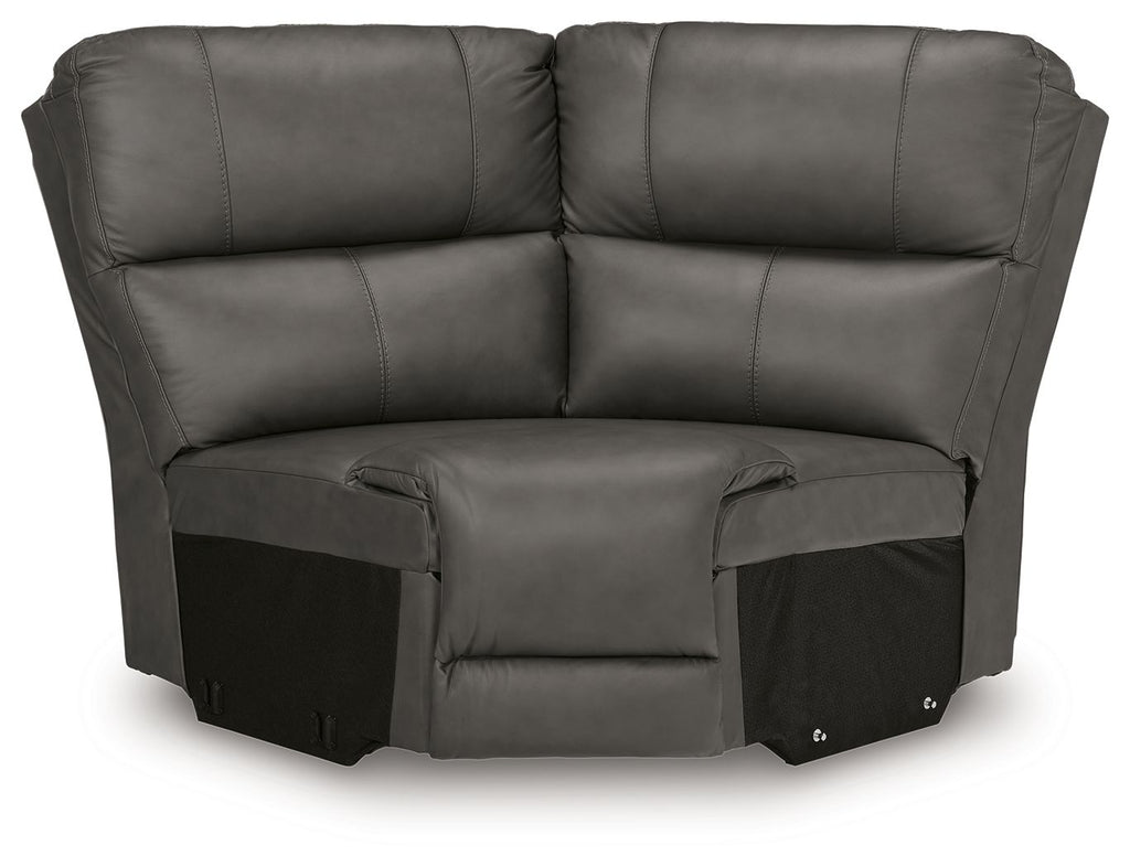 Upholstered wedge seat in dark gray with padded arms, backrest, and attached footrest