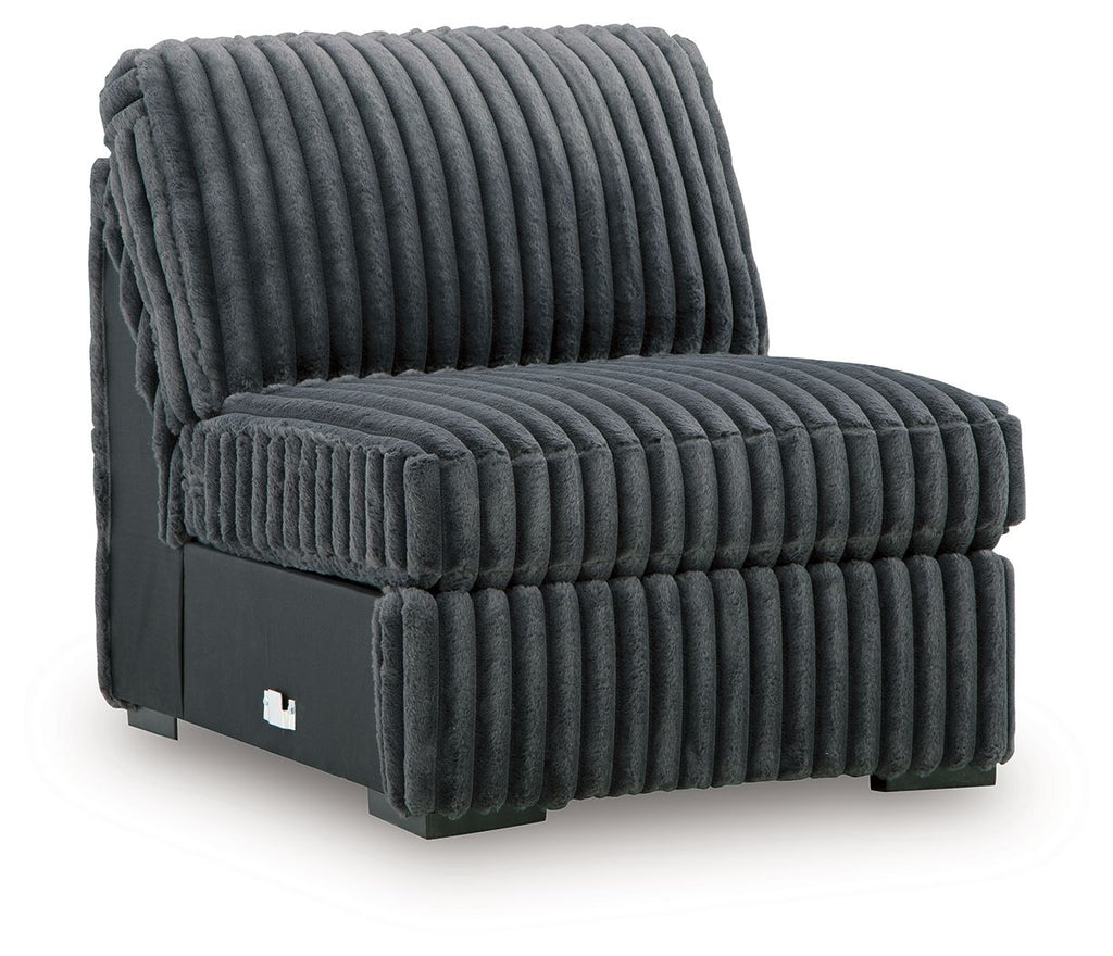 Gunmetal armless chair with ribbed seat and back cushions, side view with black base