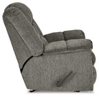 Gray rocker recliner chair, angled side view with side control handle and thick armrests