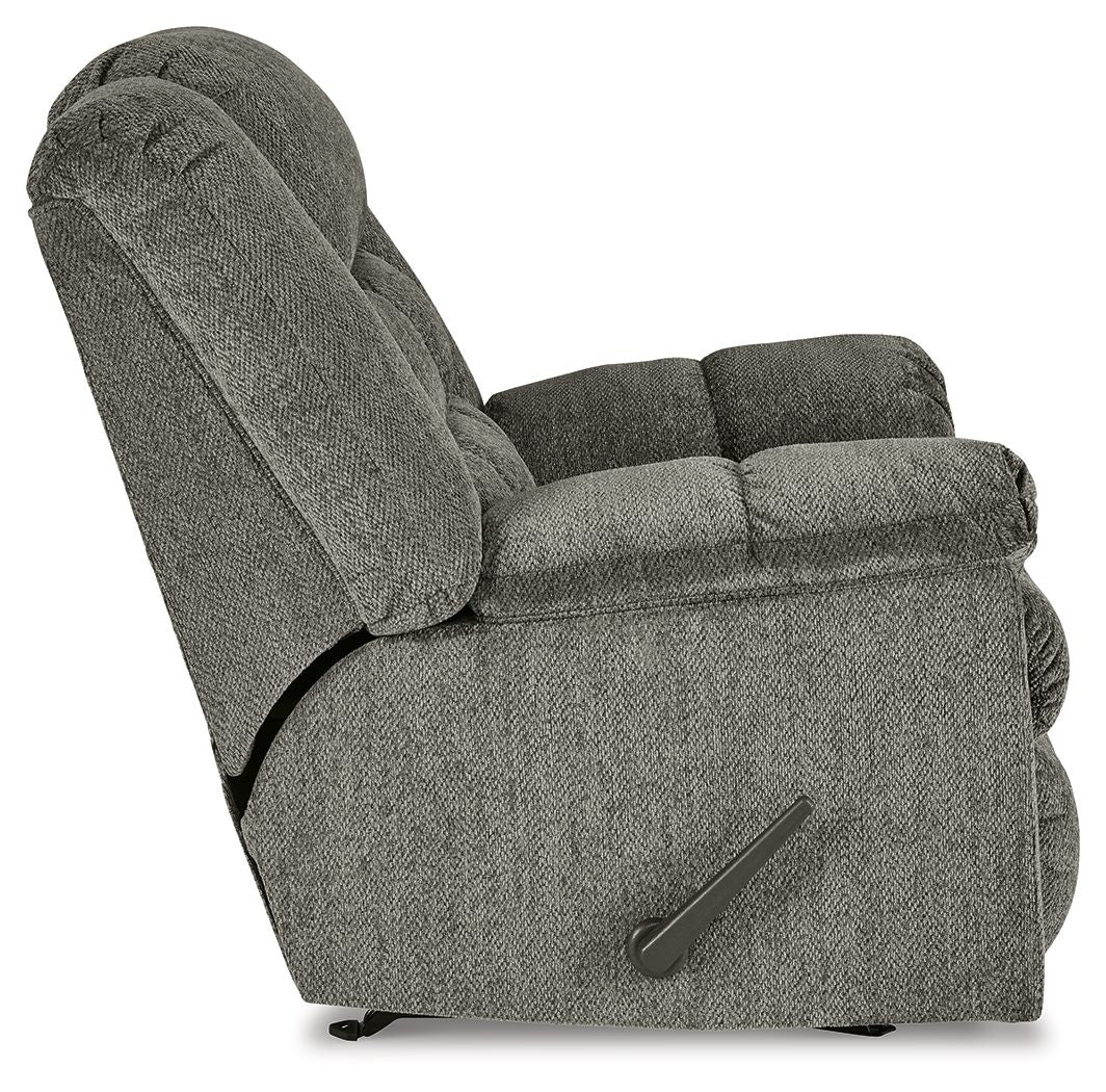 Gray rocker recliner chair, angled side view with side control handle and thick armrests