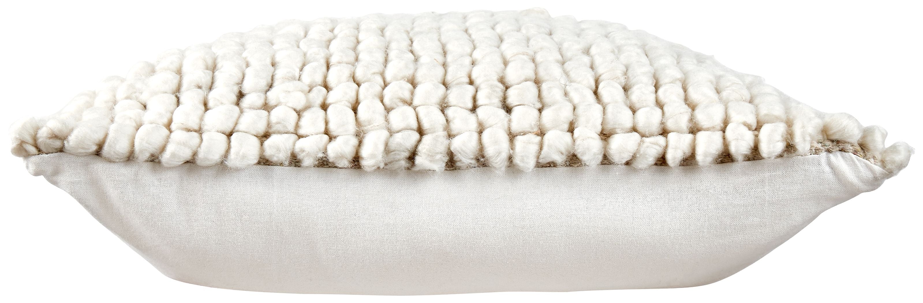 Cream square throw pillow with textured bobble weave and tasseled edge