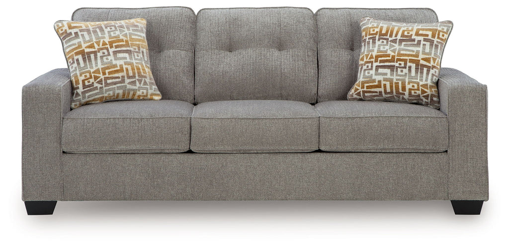 Queen sofa sleeper with gray upholstery and two patterned pillows on back cushions