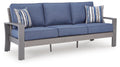 Blue-gray fabric sofa with two striped throw pillows and seat cushions