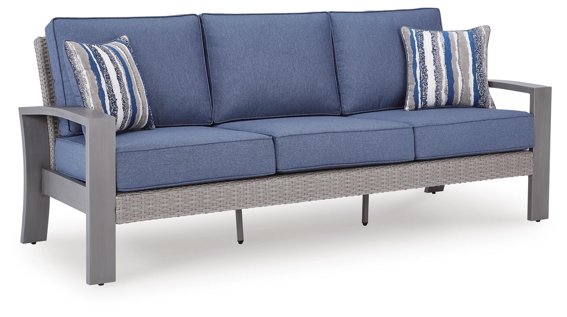 Blue-gray fabric sofa with two striped throw pillows and seat cushions