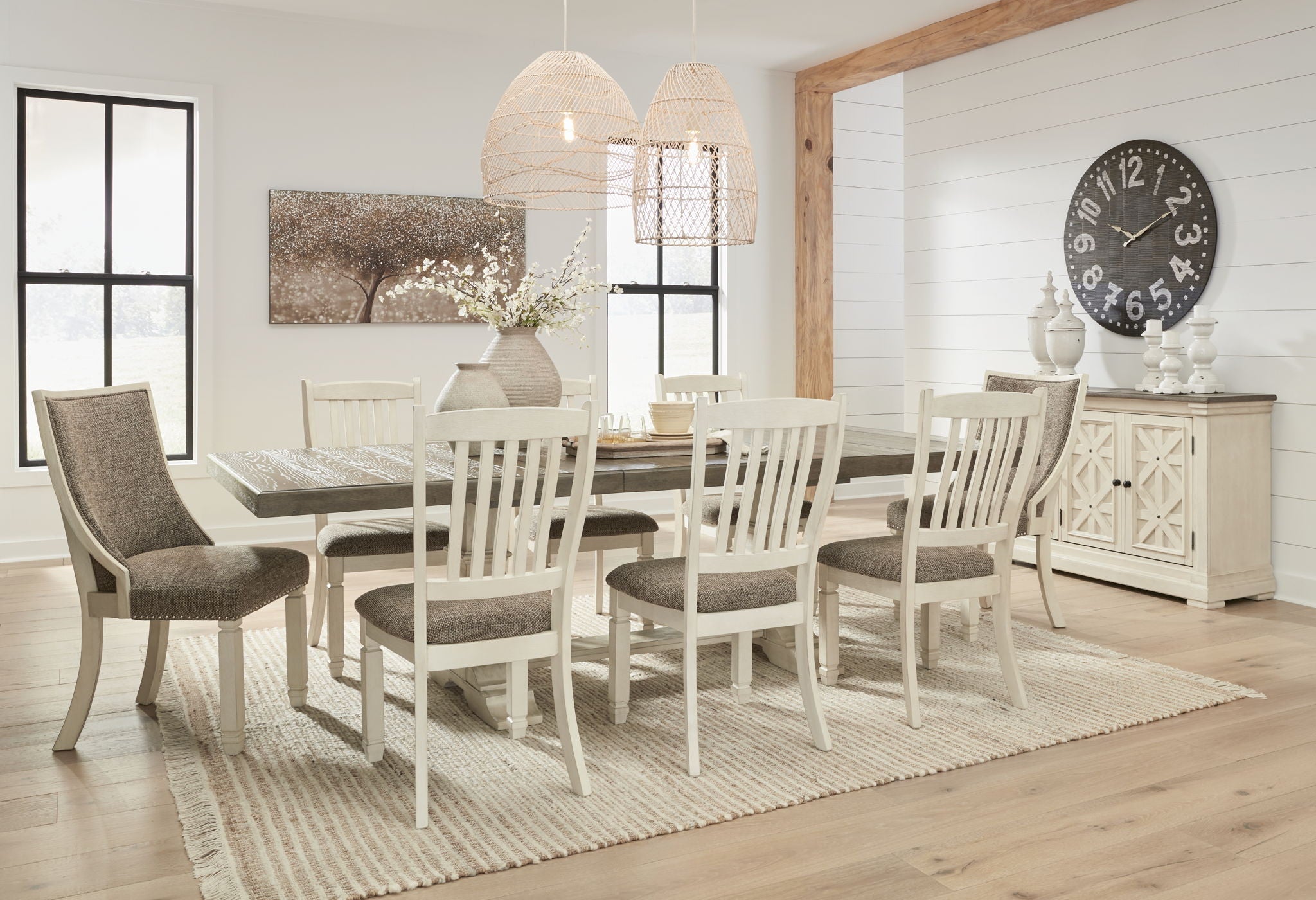 Dining room set with rectangular table, white chairs, and matching sideboard